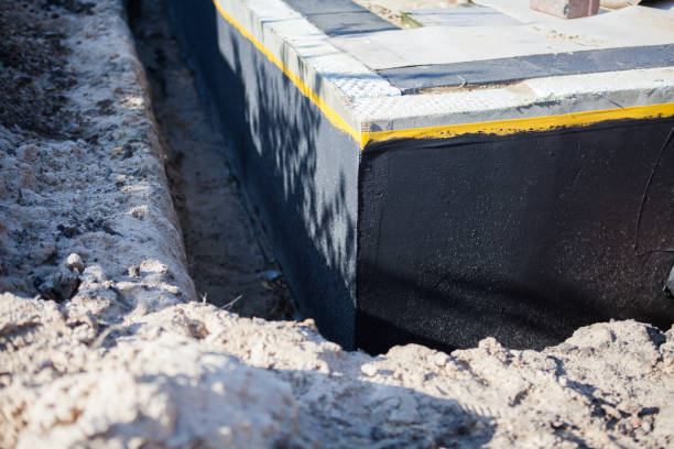 Professional Basement Waterproofing technician working in Bristol, PA